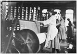 Girls at weaving machines, Evansville, IN, 10/1908