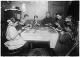 Jewish family making garters, New York City, 2/27/1912