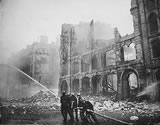Firefighters and bombed-out buildings