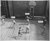 Ford playing basketball aboard the USS Monterey, c. 1943 (2 views)